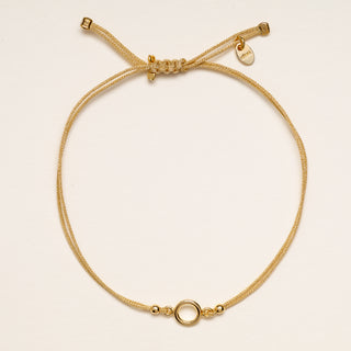 Bracciale cerchio oro cordino nero minimal