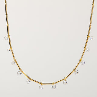 Collana in argento 925 placcato oro con zirconi pendenti lungo la catena tubolare
