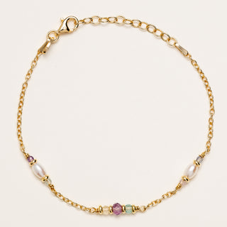 Bracciale lineare in argento dorato con perle d'acqua dolce.