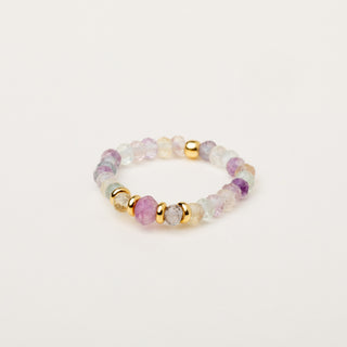 Anello elastico in argento dorato decorato con pietra fluorite.