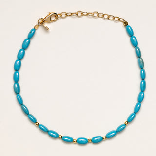 Bracciale a catena in argento placcato oro con pietra turchese.