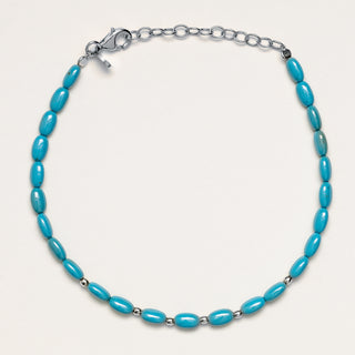 Bracciale a catena in argento rodiato con pietra turchese.