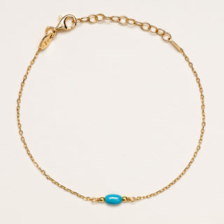 Bracciale in argento placcato oro decorato con pietra turchese.