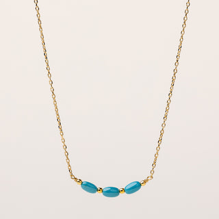 Collana in argento dorato con inserti di pietra turchese.