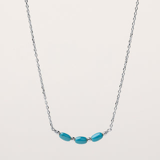 Collana in argento rodiato con inserti di pietra turchese.