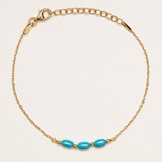 Bracciale in argento 925 dorato con inserti geometrici in turchese.