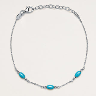 Bracciale a catena in argento rodiato con pietra turchese naturale.