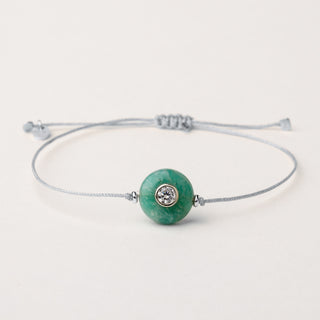 Bracciale a filo con argento rodiato, pietra naturale e zircone.