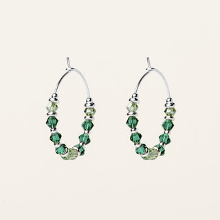 Orecchini in argento 925 Rodiato con cristallo verde dal design geometrico essenziale.