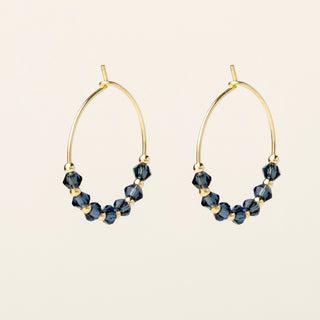 Orecchini in argento 925 dorato con cristallo ghiaccio dal design geometrico essenziale.