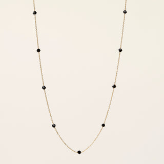Collana in argento 925 dorato con cristallo rosso dal design geometrico essenziale.