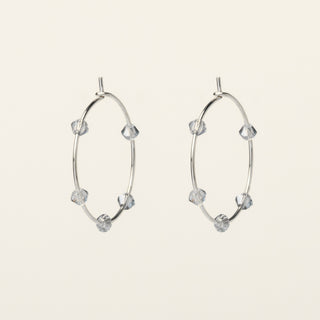 Orecchini in argento 925 Rodiato con cristallo rosso dal design geometrico essenziale.