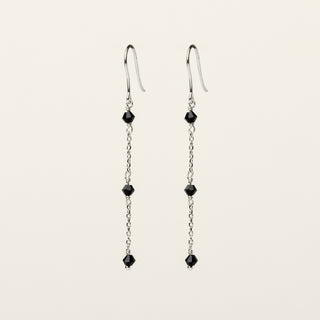 Orecchini in argento 925 Rodiato con cristallo rosso dal design geometrico essenziale.