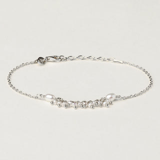 Bracciale in argento 925 Rodiato con perle d'acqua dolce dal design geometrico essenziale.