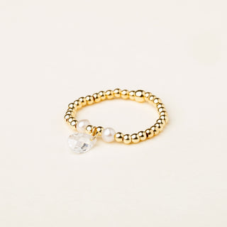 Anello in argento 925 dorato con perle e zirconia dal design geometrico essenziale.