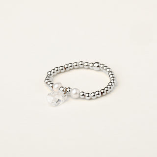 Anello in argento 925 Rodiato con perle e zirconia dal design geometrico essenziale.