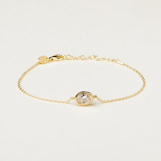 Bracciale a catena in argento dorato con centrale sagomato e zircone.