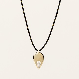 Collana filo regolabile con pendente a goccia e zircone dorato Collezione Tacto.