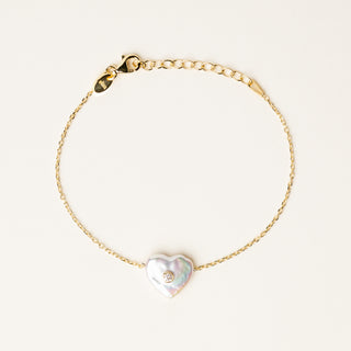 Bracciale catena sottile in argento dorato con elemento organico e zircone.