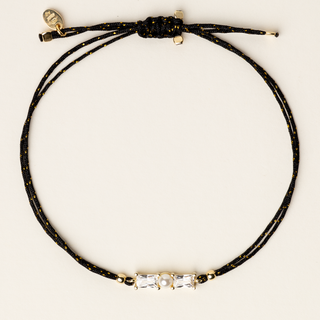 Bracciale a filo regolabile con perla naturale d'acqua dolce e zirconi dorati.