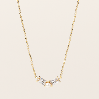 Collana catenina dorata con pendente perla naturale d'acqua dolce e zircone.