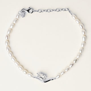 Bracciale in argento 925 Rodiato con perle e zirconia dal design geometrico essenziale.