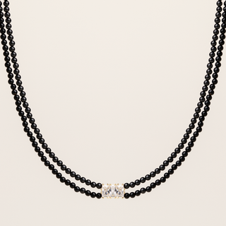 Collana doppia catena in argento dorato con agata nera naturale e zirconi.
