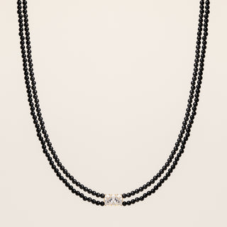 Collana doppia catena in argento dorato con agata nera naturale e zirconi.