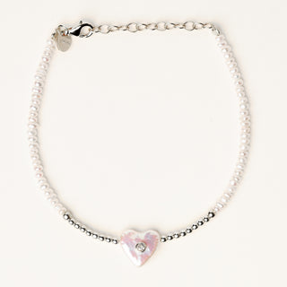 Bracciale in argento 925 Rodiato con perle d'acqua dolce dal design geometrico essenziale.