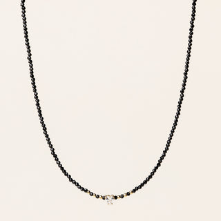 Collana in argento 925 dorato con spinello e zirconia dal design geometrico essenziale.