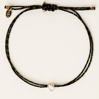 Bracciale a filo regolabile con zircone centrale taglio cuore e argento dorato.
